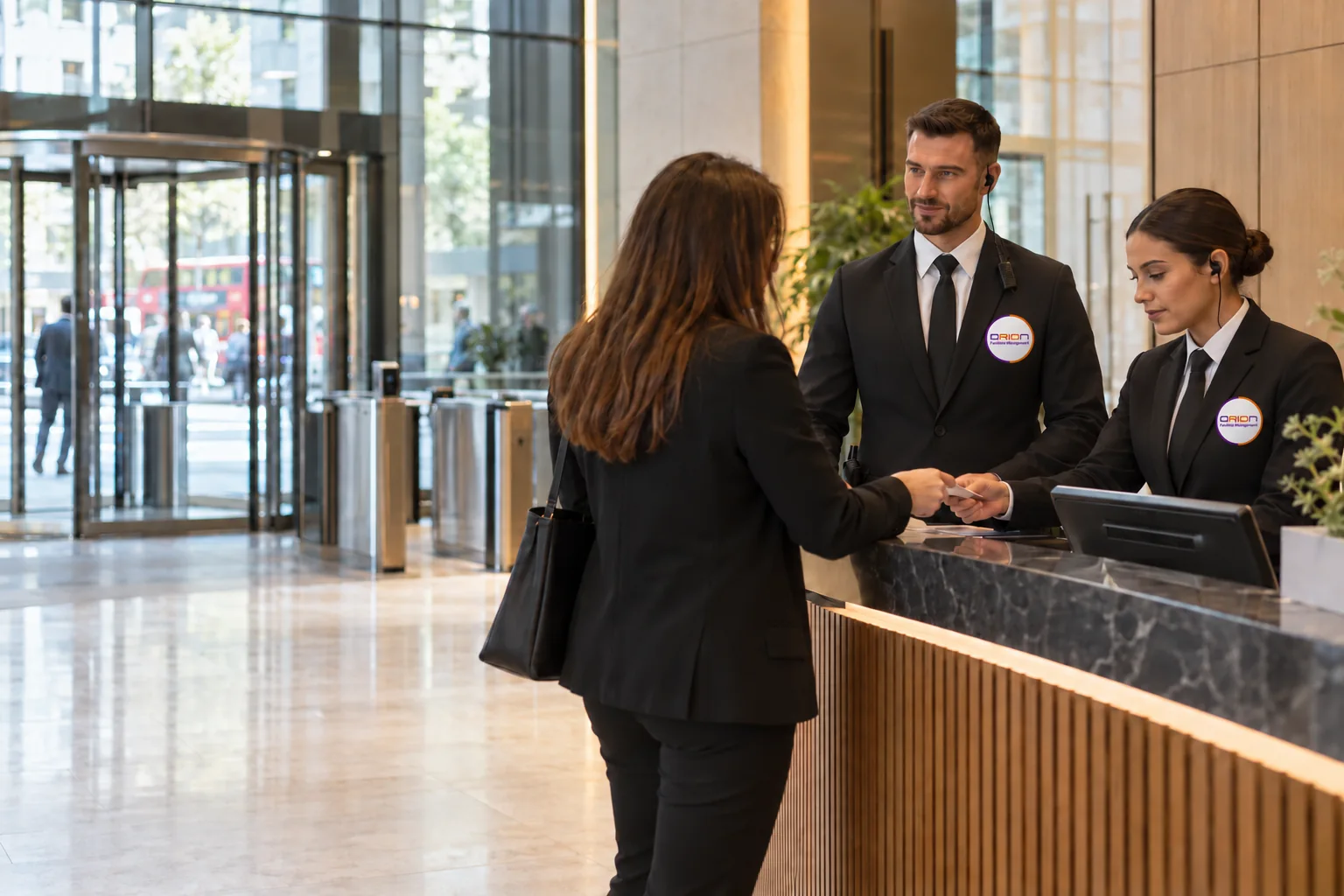 Illustrative security officers in black suits, white shirts and black ties at an office reception